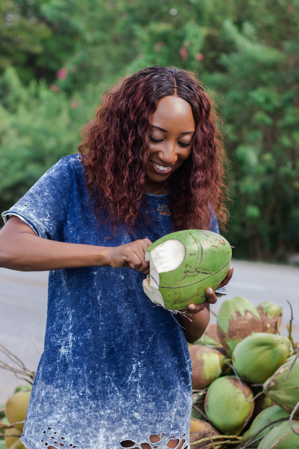 woman cuts coconut