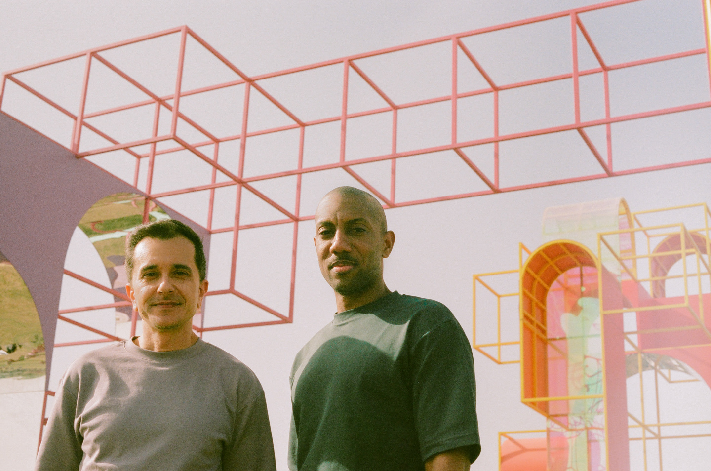 two men with colorful structure