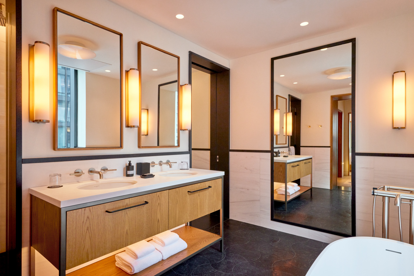 A suite bathroom at a hotel.