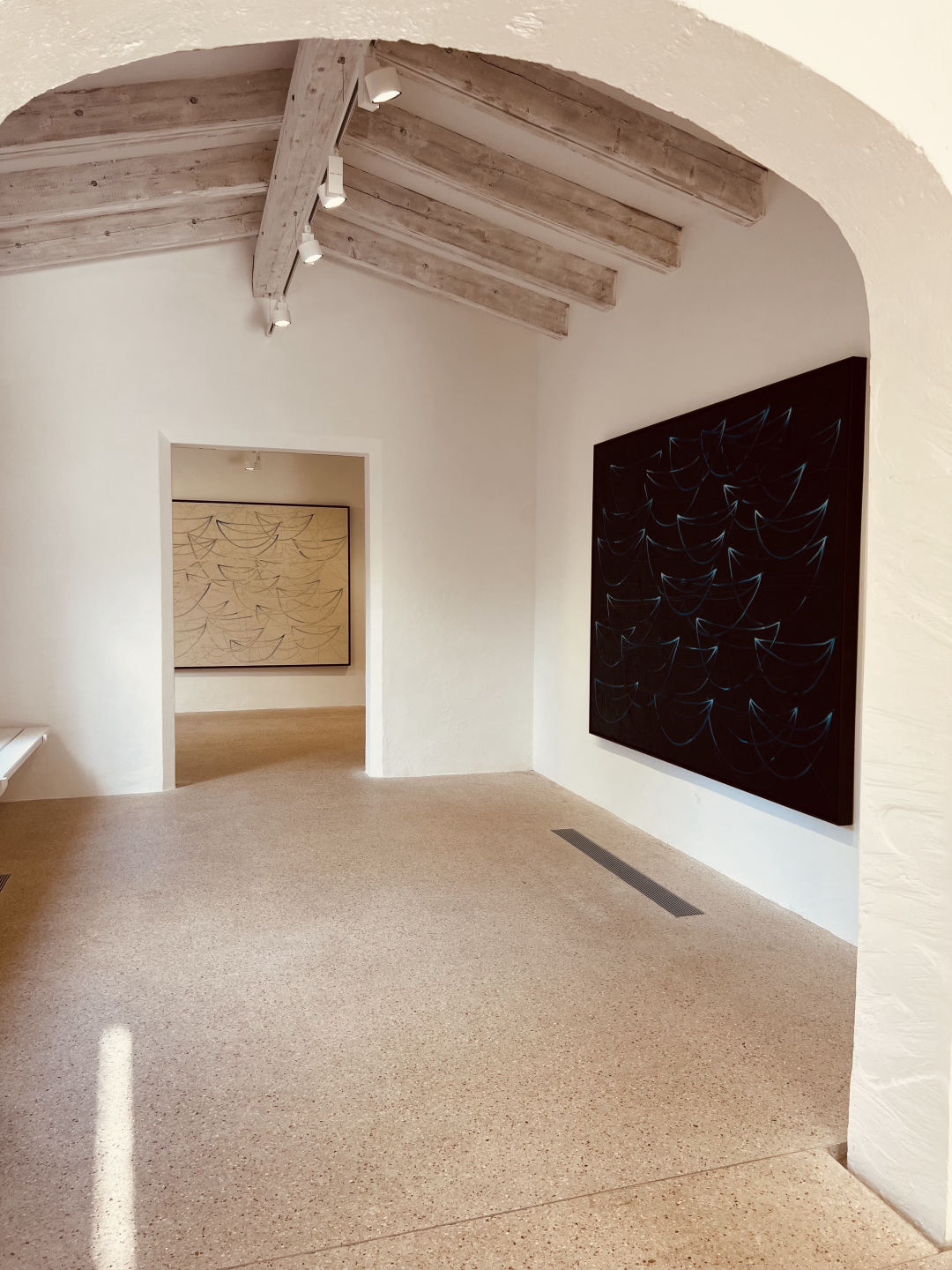 A painting in gallery hallway.