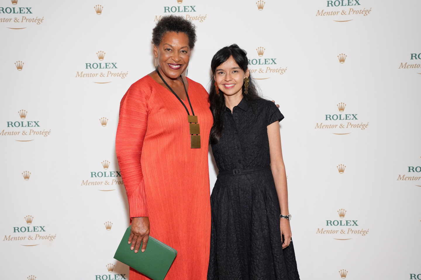Carrie Mae Weems and her protégé posing for a photo.