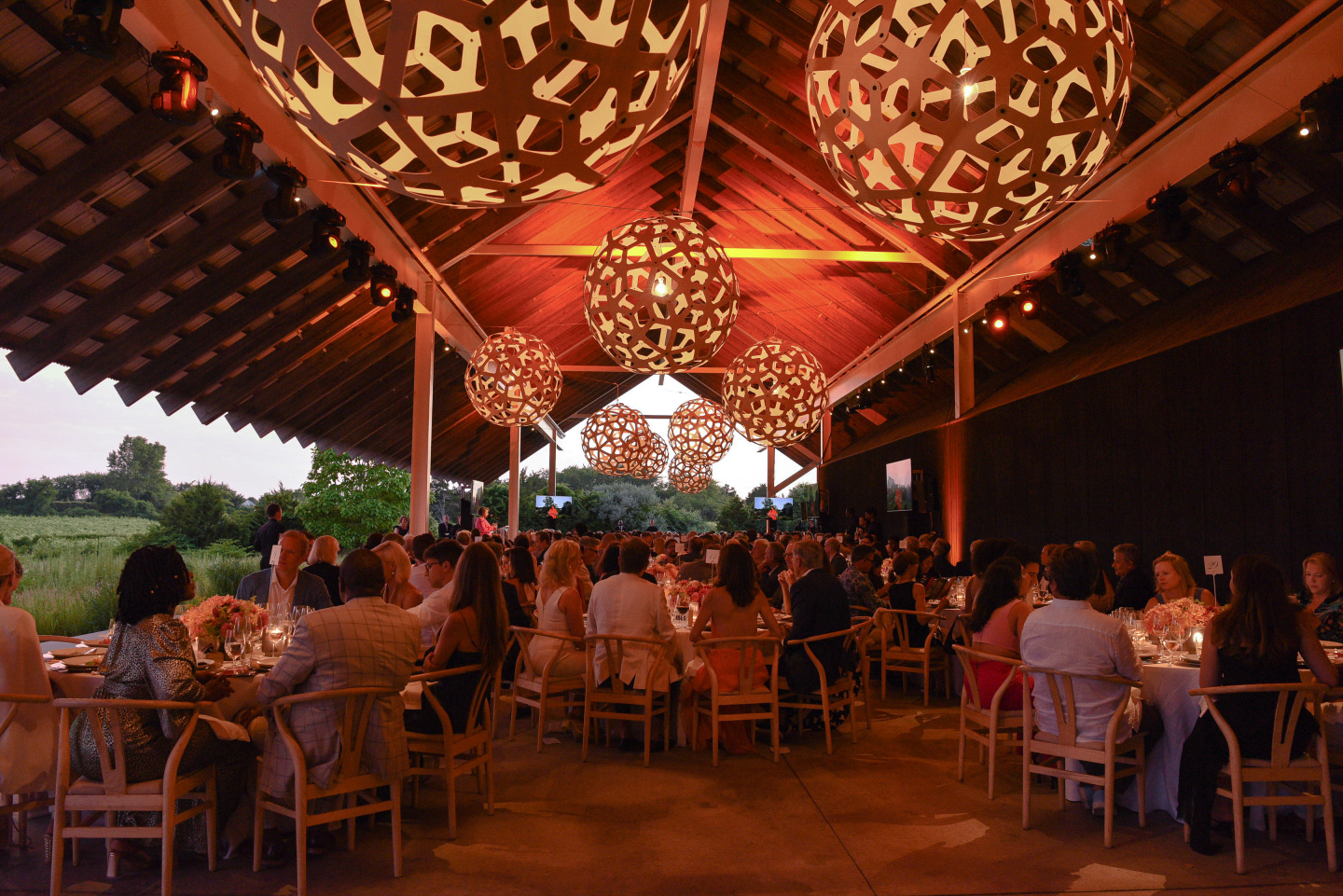 Guests sit in the Mildred C. Brinn Terrace.
