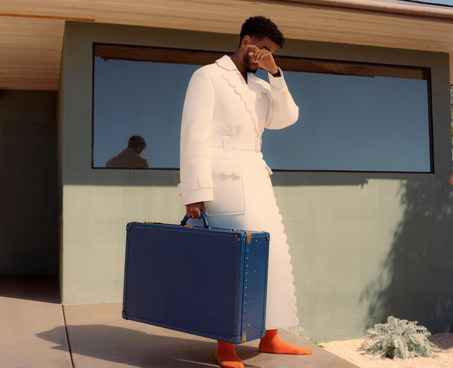 man standing with bag
