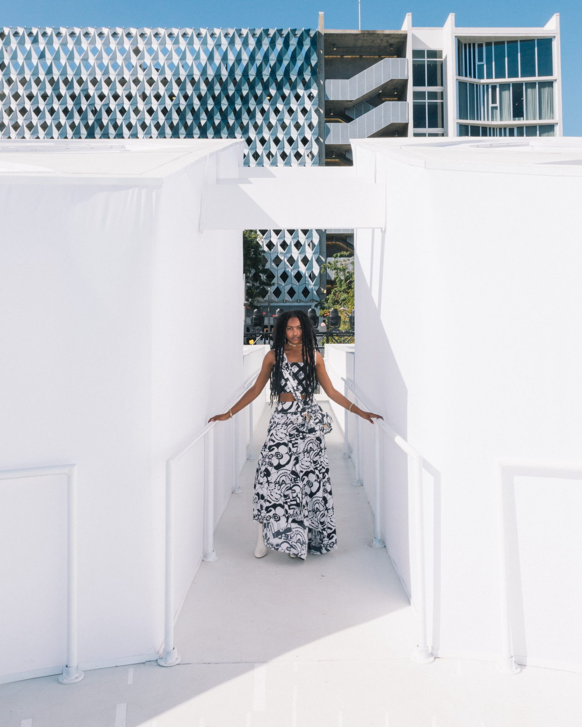 woman standing in white structure