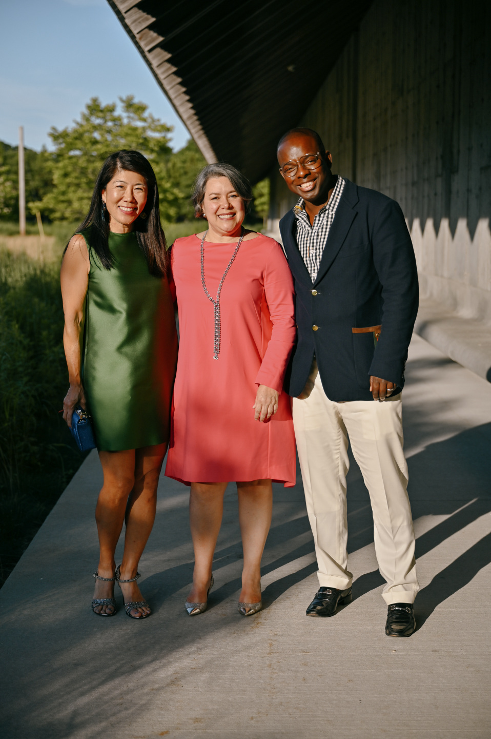 Three guests pose together
