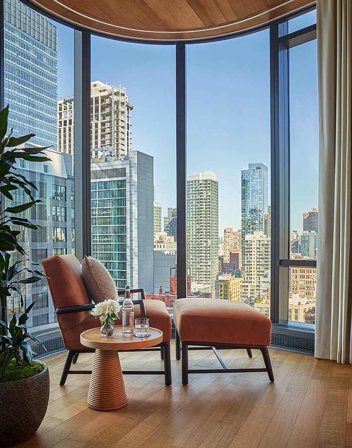 A seating area in the suite of a hotel.