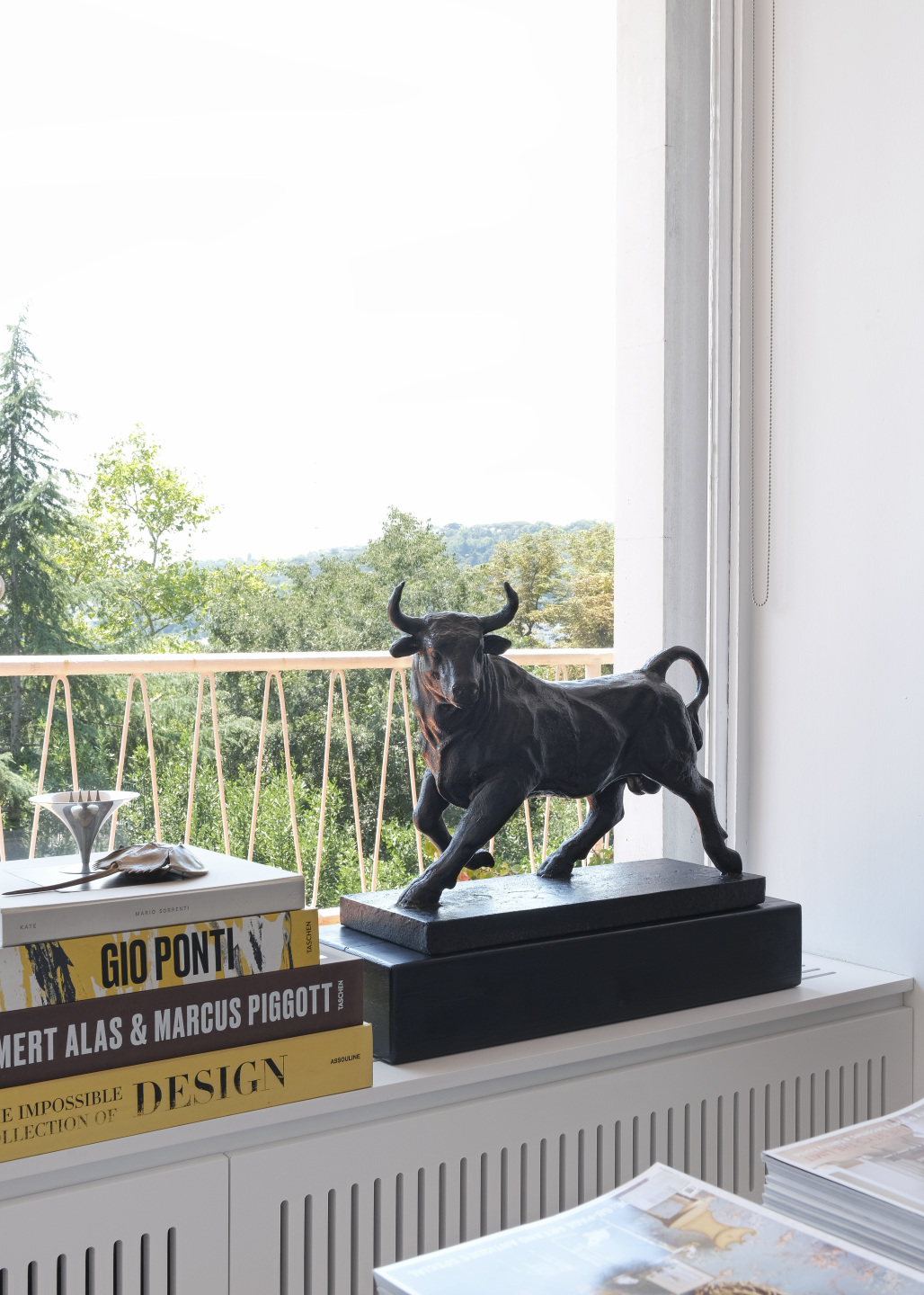 Antique bronze bull statue installed in a home.