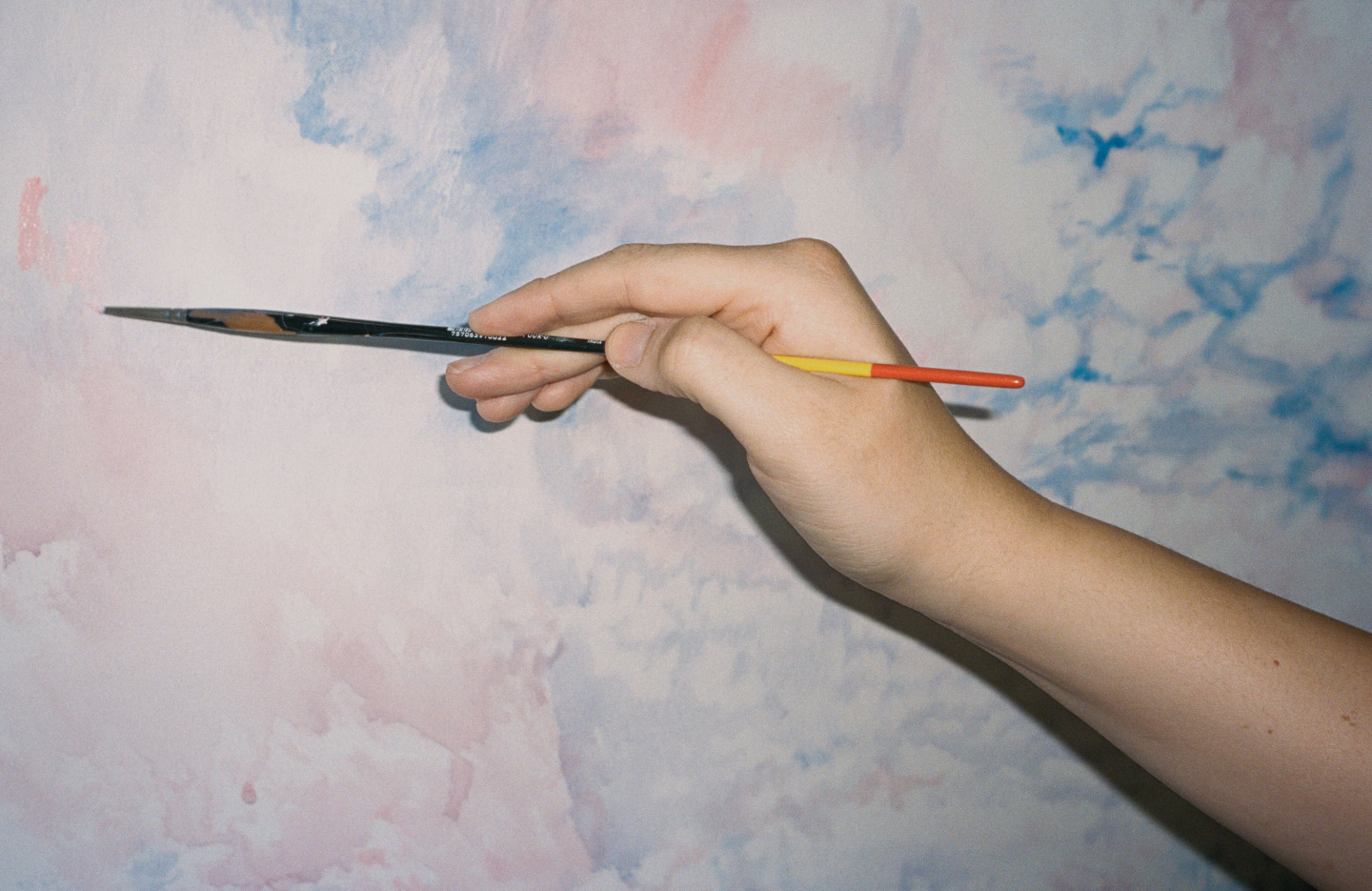 paintbrush in hand