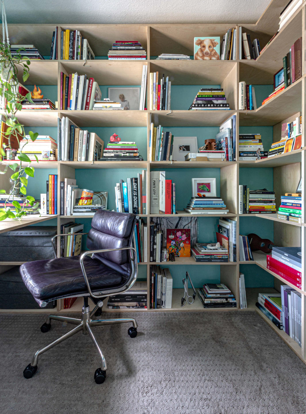 Home office with artwork and books throughout.
