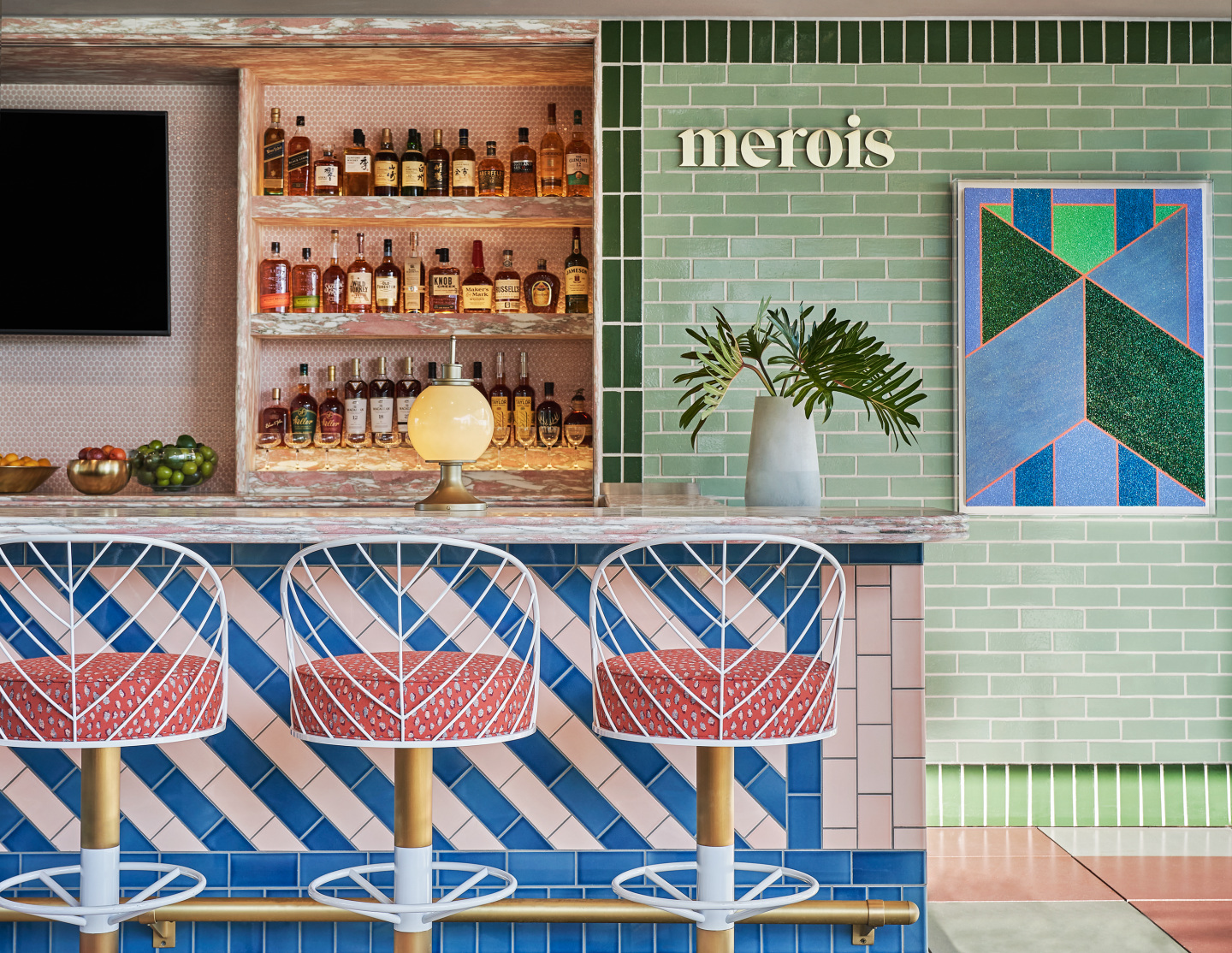 A bar with colorful tiles at a rooftop restaurant.