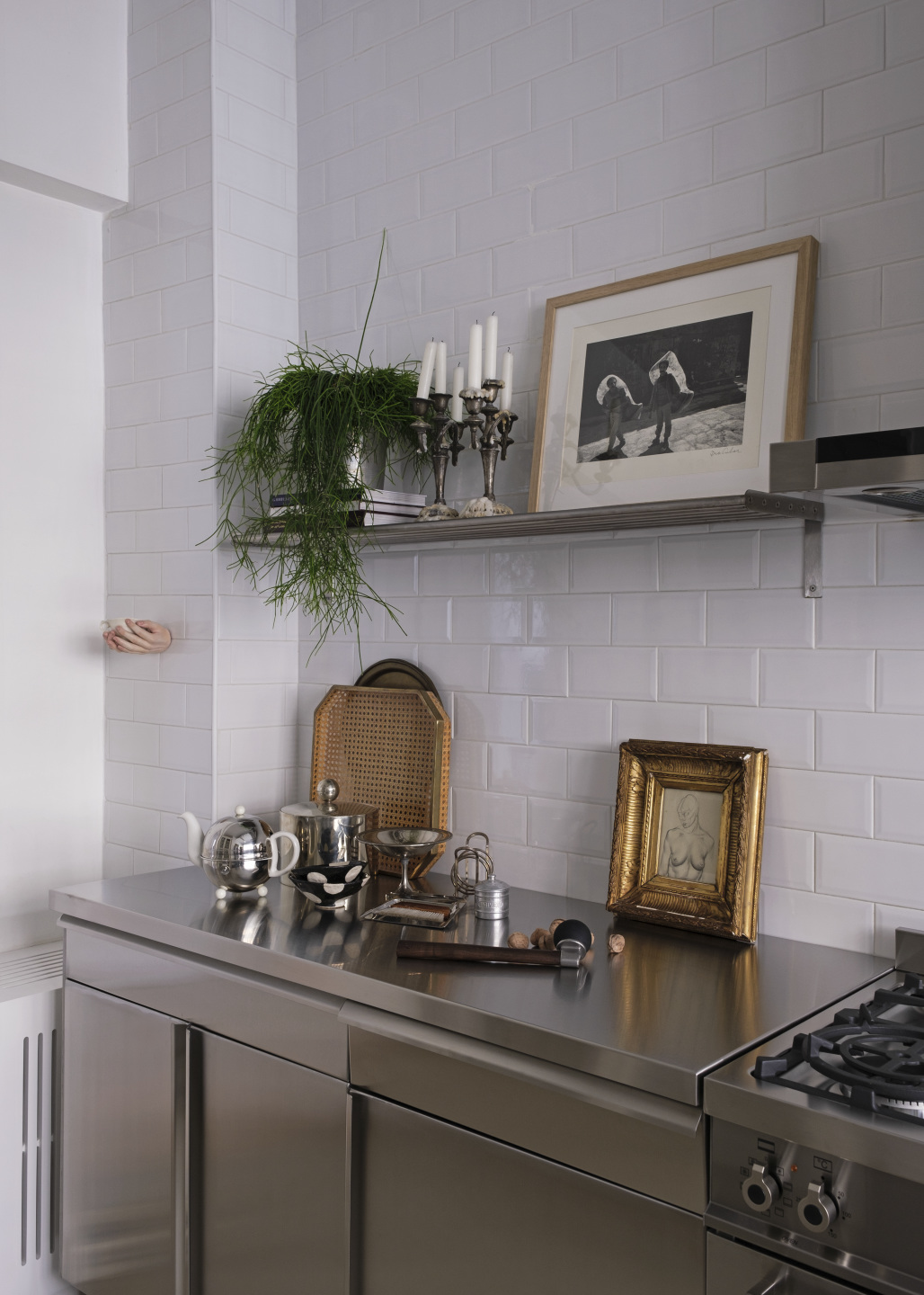 Framed painting in the kitchen.