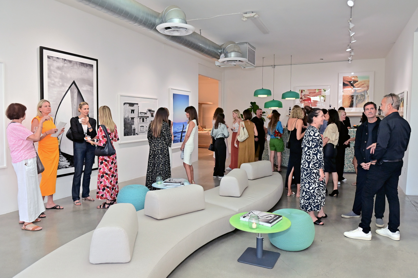 guests stand throughout the showroom