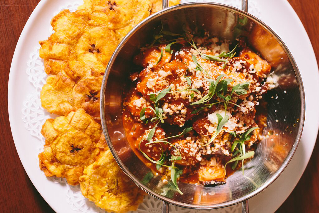 A meat dish with tostones at Azucena.