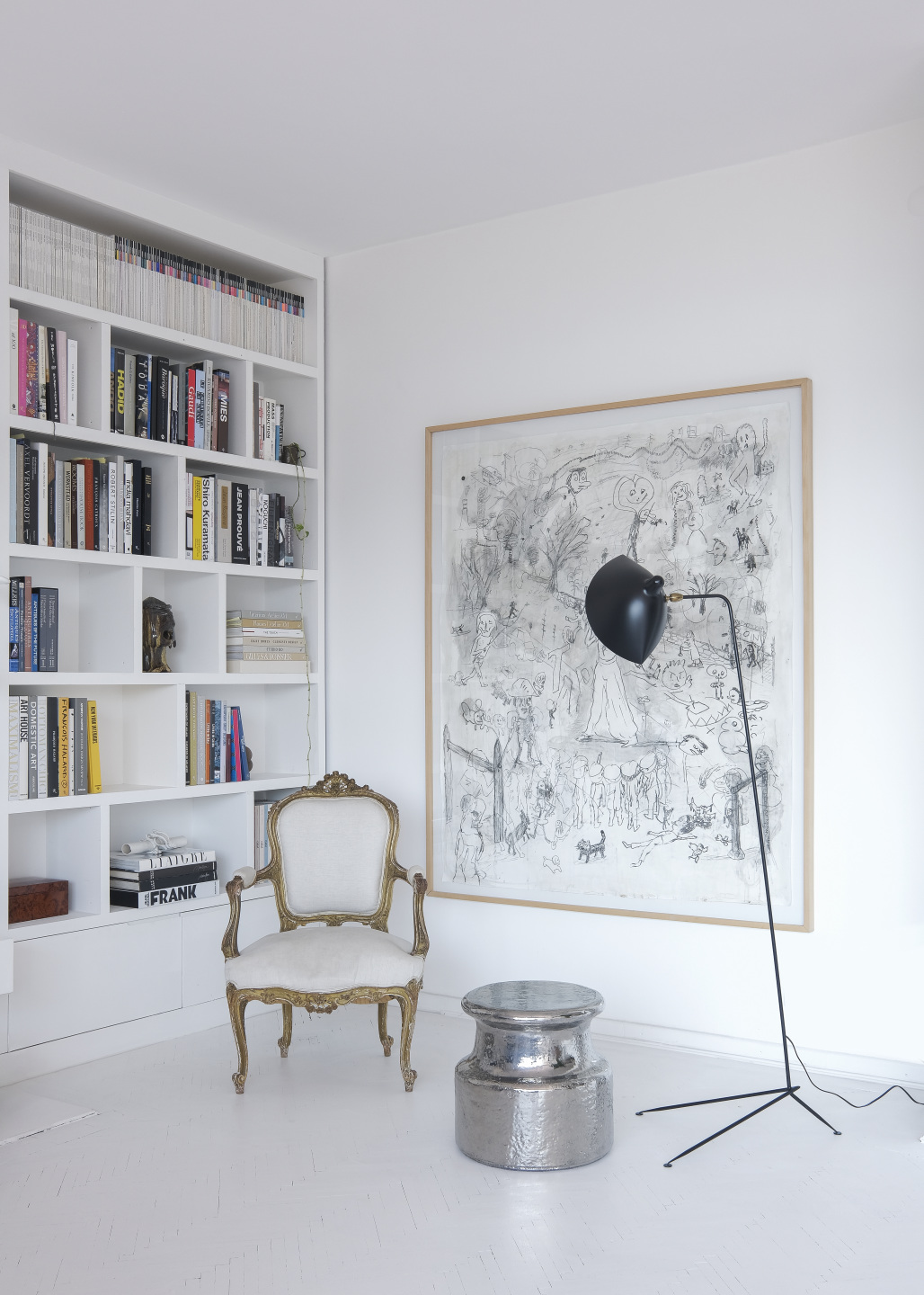 A metal sculpture and Painting in the living room of the home.