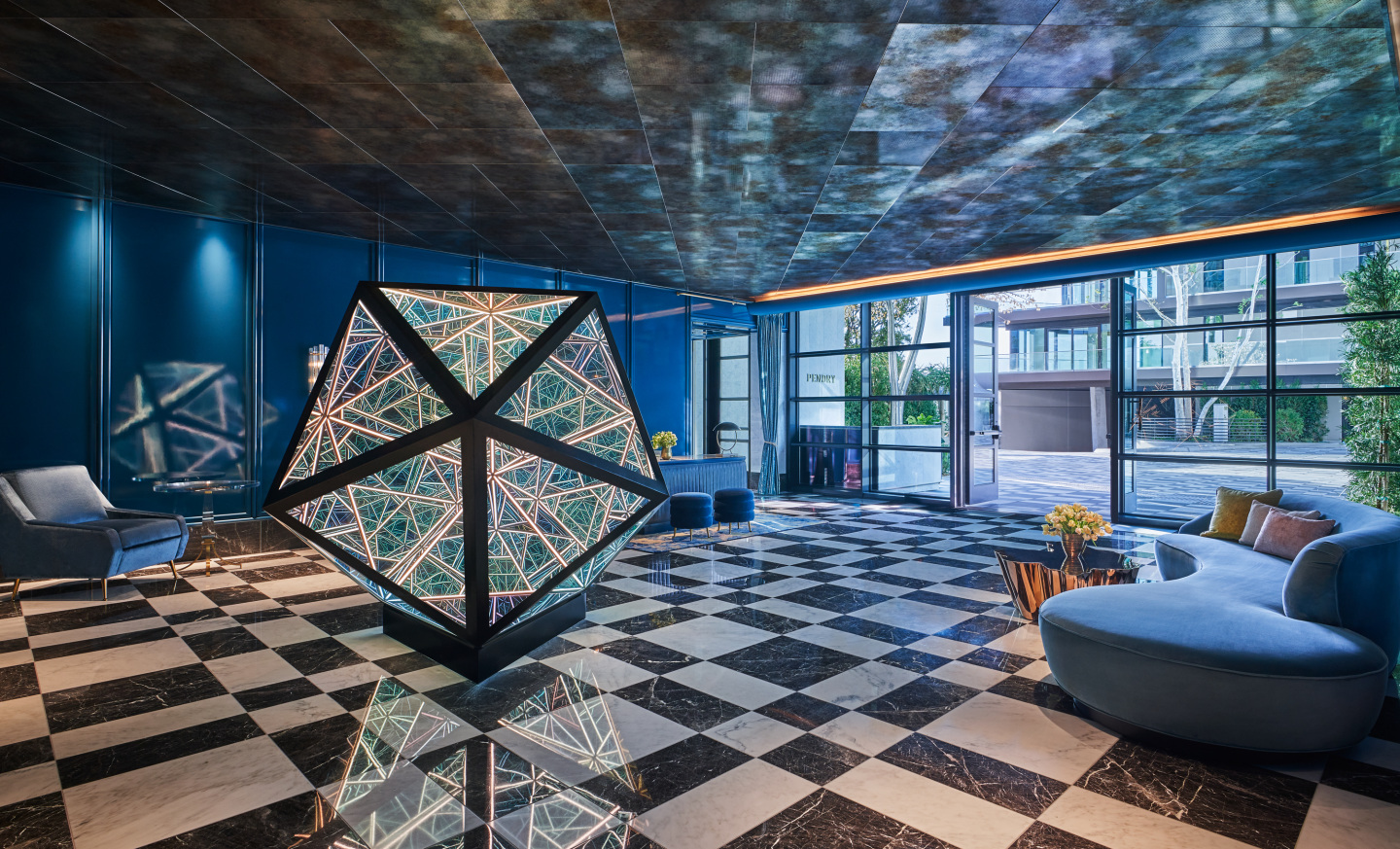 The lobby of a hotel with geometric decorations.