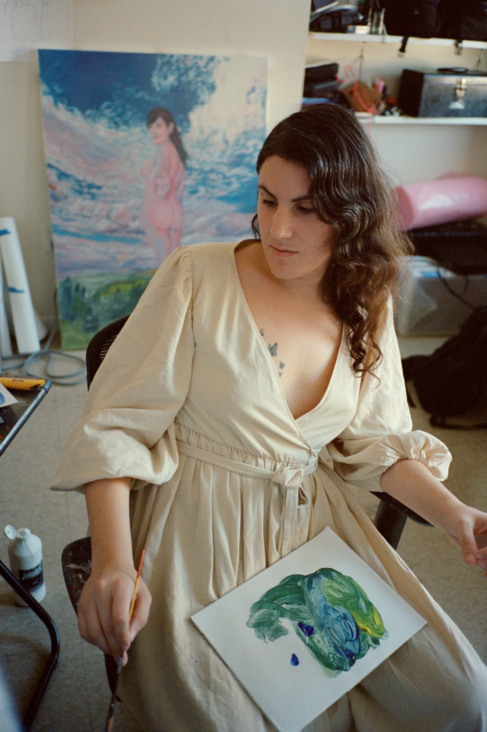 woman in chair painting