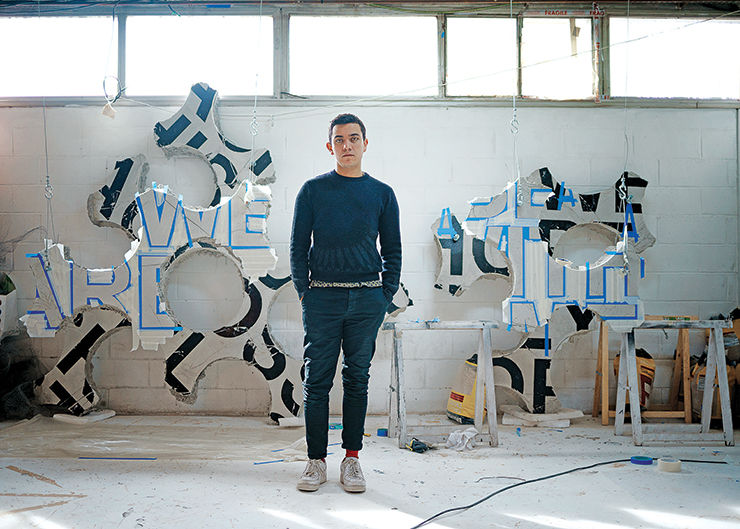 Argote in front of his work in progress, <em>Among us</em>, in his Paris studio. Portrait by Claire Dorn. ” width=”740″ height=”529″><figcaption>Argote in front of his work in progress, <em>Among us</em>, in his Paris studio. Portrait by Claire Dorn. </figcaption></figure>
</p><p>In 2008, the Colombian conceptual and video artist Iván Argote walked up to gallerist Emmanuel Perrotin at an exhibition opening, introduced himself and asked for Perrotin’s card. Perrotin told Argote, then a 25-year-old M.F.A. student at École Nationale Supérieure des Beaux-Arts in Paris, that he was busy at the time and to please not be offended should he not respond.</p><p>Nevertheless, Argote sent him a link to his website featuring photographs, computer applications and short videos of guerrilla style performances shot in the Metro and streets of Paris. “I found his work very cheeky and I loved it,” says Perrotin, who invited the artist to show in a group exhibition the following year at (the now closed) <a href=