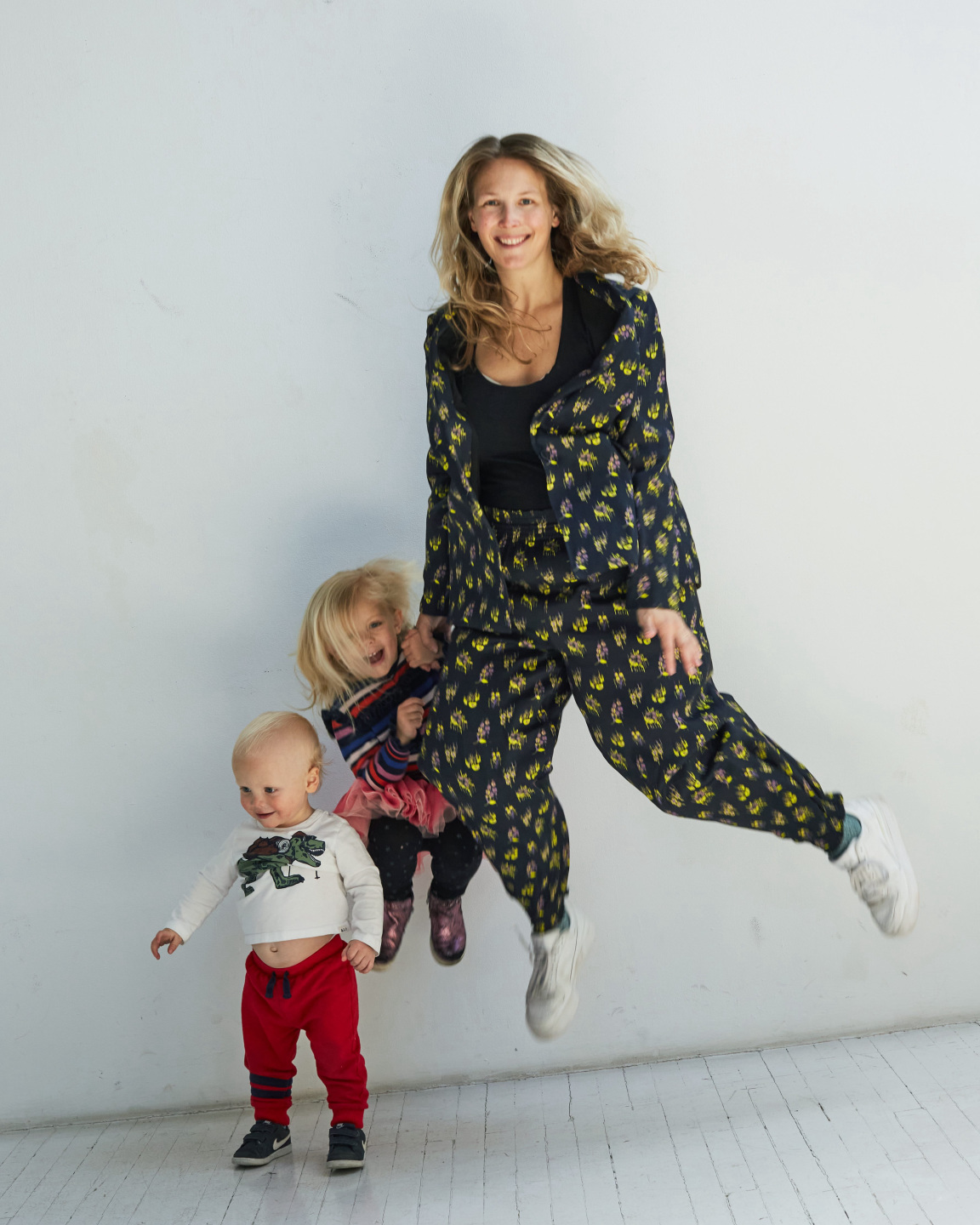 mom and kids jumping