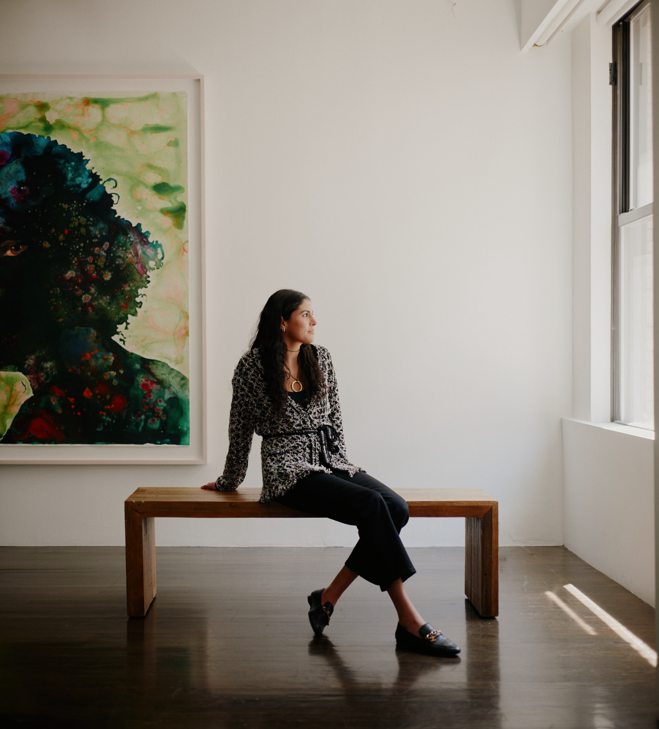 woman on bench in gallery