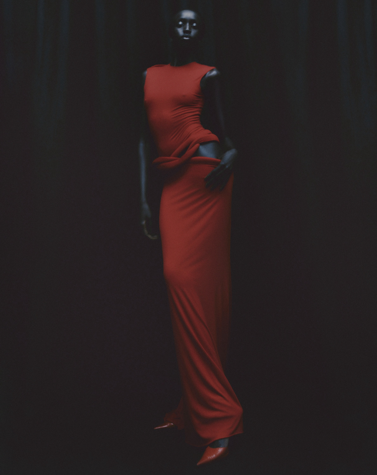 Standing-Ground-Nyaueth-Riam-red-dress