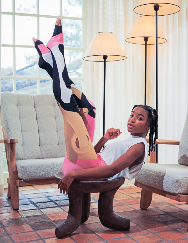 girl on stool with legs up