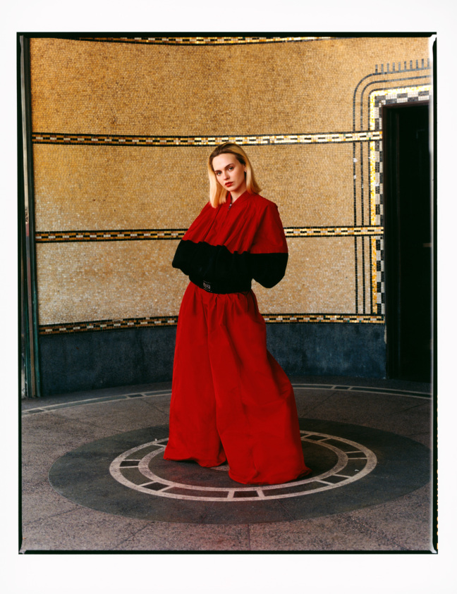 woman wears red tracksuit
