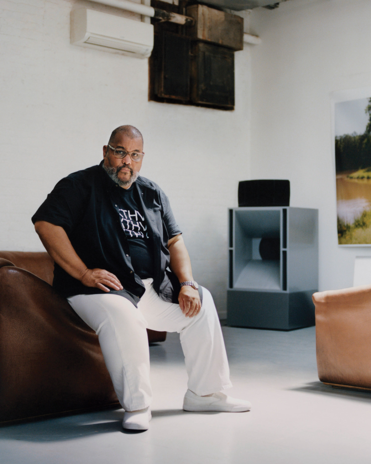 A man sitting in a studio.