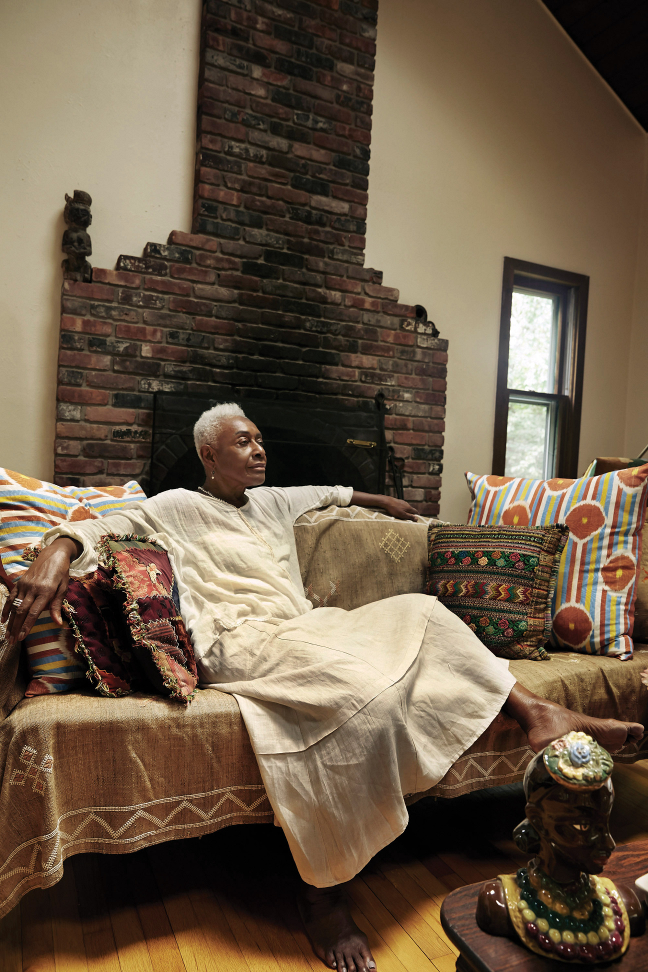 A woman sitting on a couch.