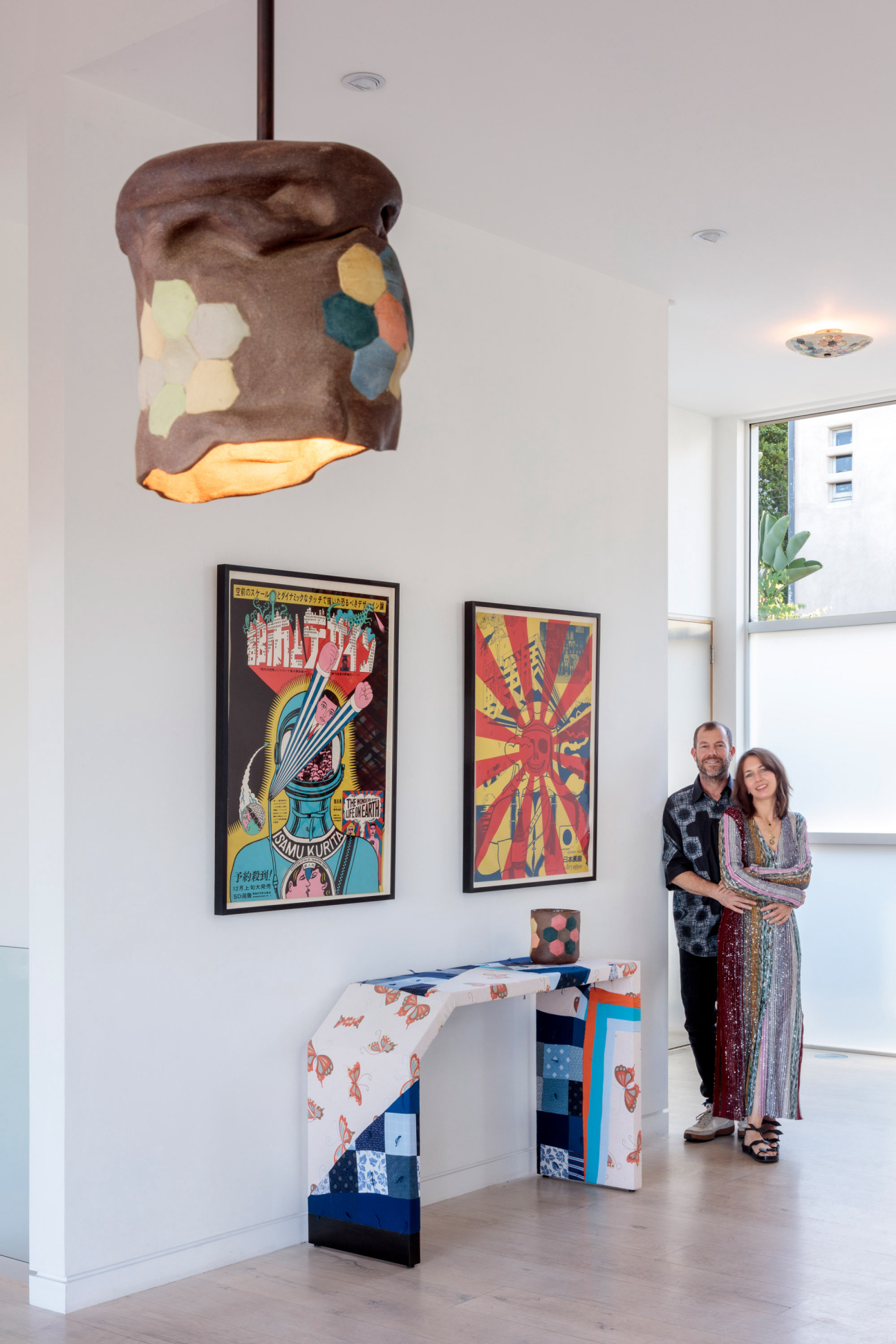 two people embrace in gallery