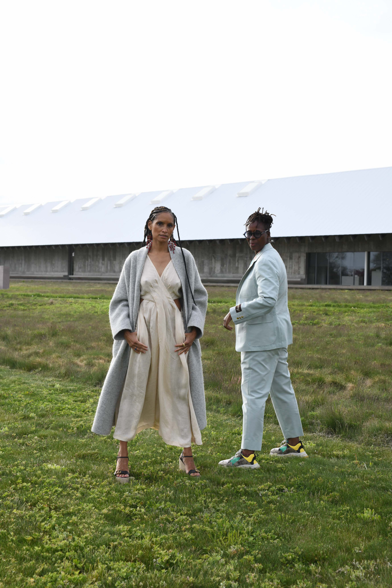 Co-curators of "Set it Off" pose in garden at Parish Art Museum