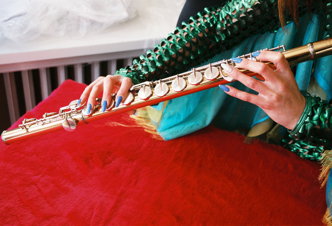 close up of woman playing instrument