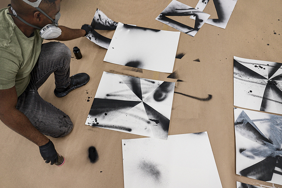 Artist-Adam Pendleton-painting-in-his-studio