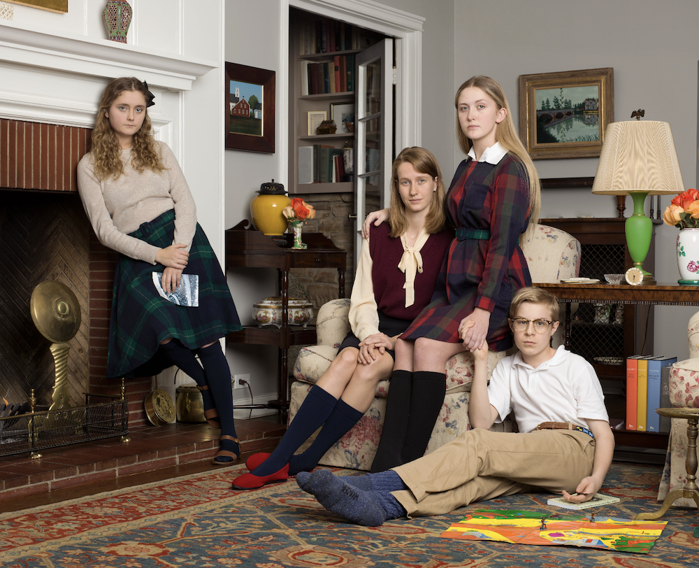 Four-children-seated-in-living-room