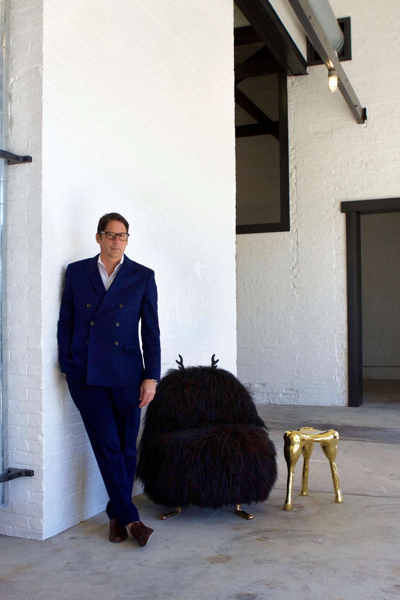 Man leans against wall