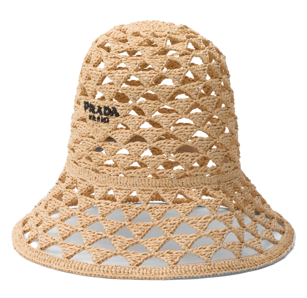 A crocheted hat with a Prada logo