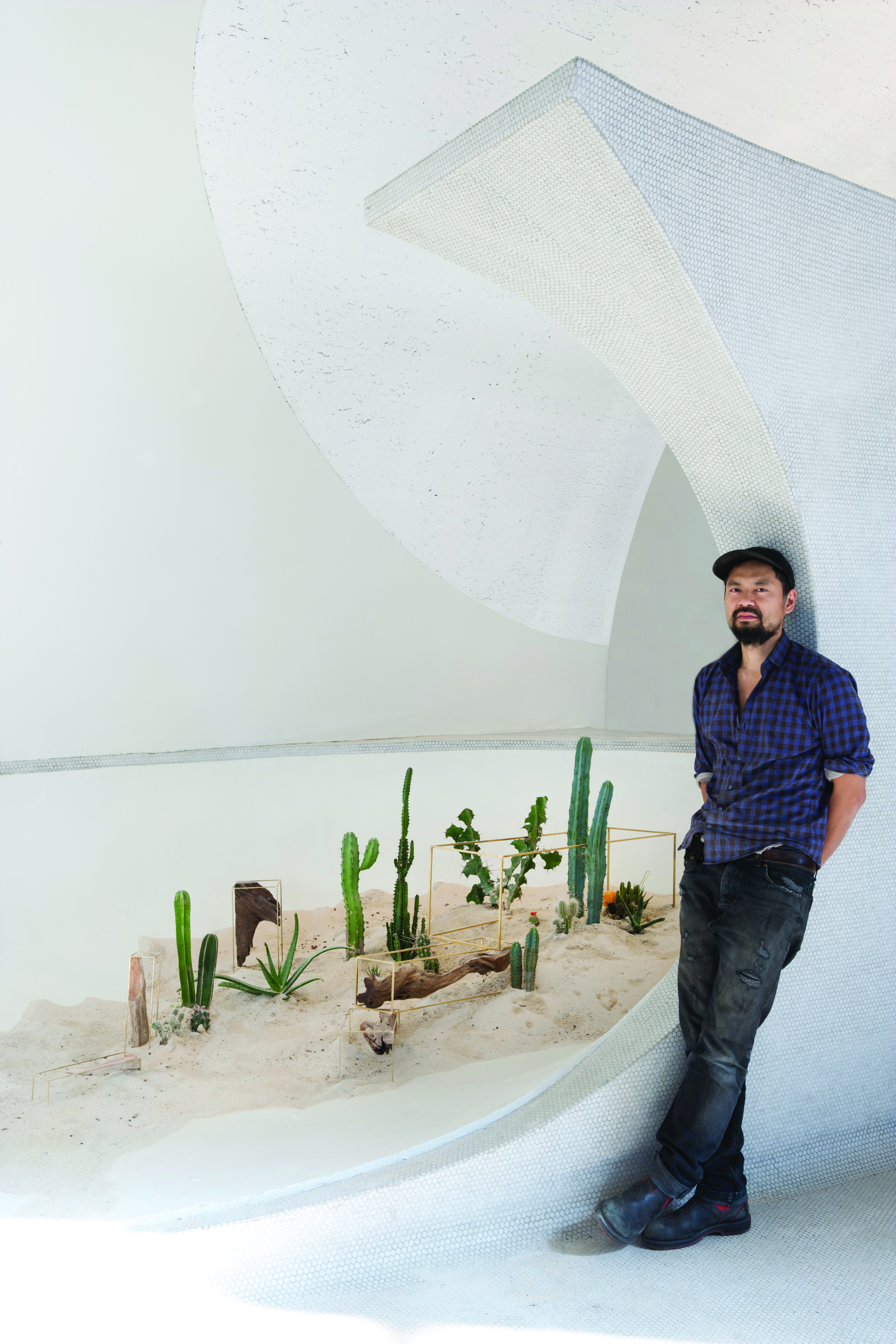Huy Bui with his installation at JFK's Eero Saarinen TWA terminal.  