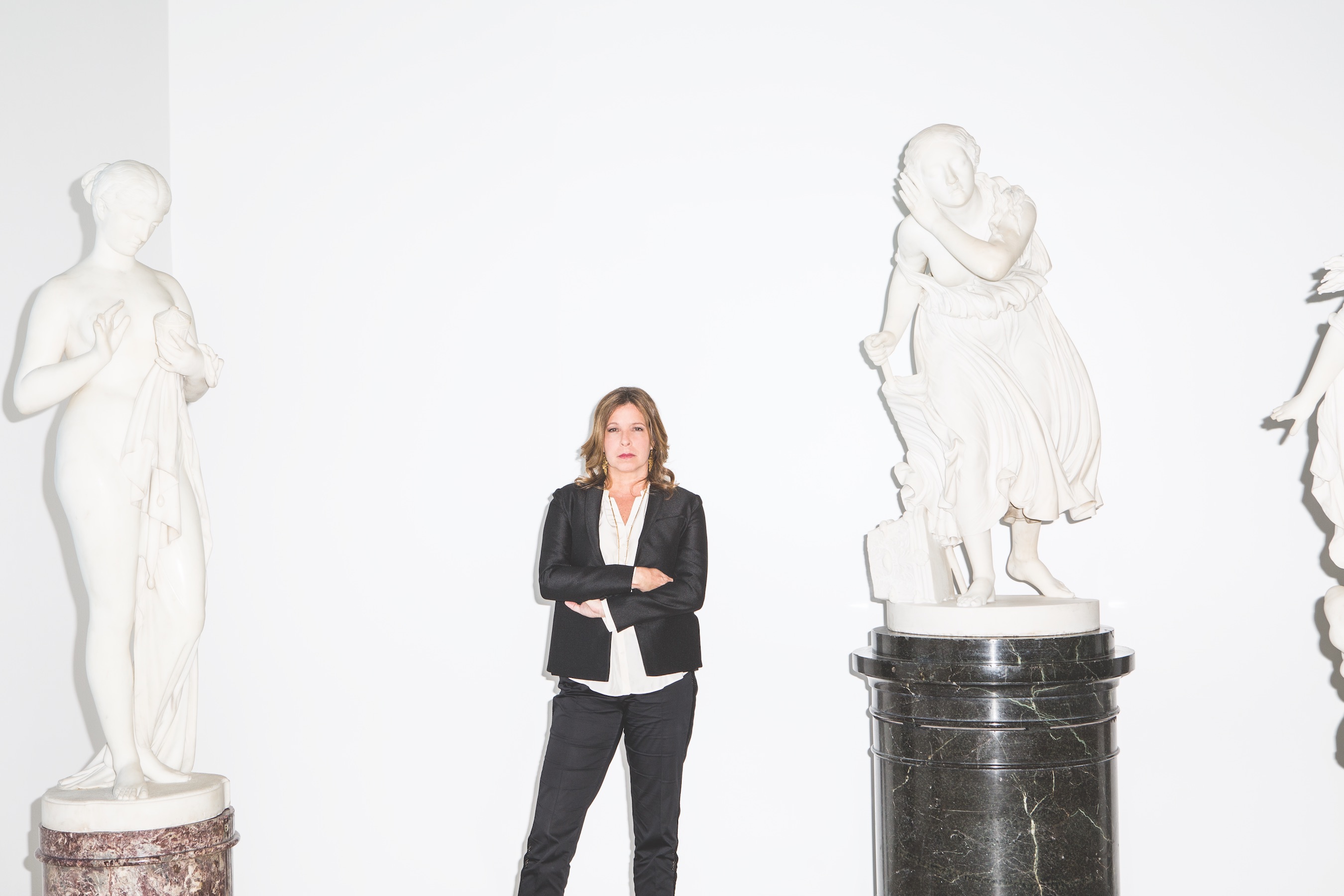 Pasternak’s reinstallation of the museum’s notable American collections includes Chauncey Bradley Ives’ <em>Pandora</em>, 1871 (left), and Randolph Roger’s <em>The Lost Pleiad</em>, 1874-1875 (right). ” width=”2700″ height=”1800″><figcaption>Pasternak’s reinstallation of the museum’s notable American collections includes Chauncey Bradley Ives’ <em>Pandora</em>, 1871 (left), and Randolph Roger’s <em>The Lost Pleiad</em>, 1874-1875 (right). </figcaption></figure>
</p><p>It’s late afternoon on a Thursday, and Anne Pasternak is in the middle of another long day—she often works until midnight in her relatively new position as director of the Brooklyn Museum.</p><p>In her outer office, she sits under a Modigliani portrait and slips off her white Maria Cornejo shoes. Barefoot, she descends a secret staircase from the executive offices into the museum’s galleries of American art. The guard who is stationed there looks at the shoeless boss but remains unfazed.</p><div class=