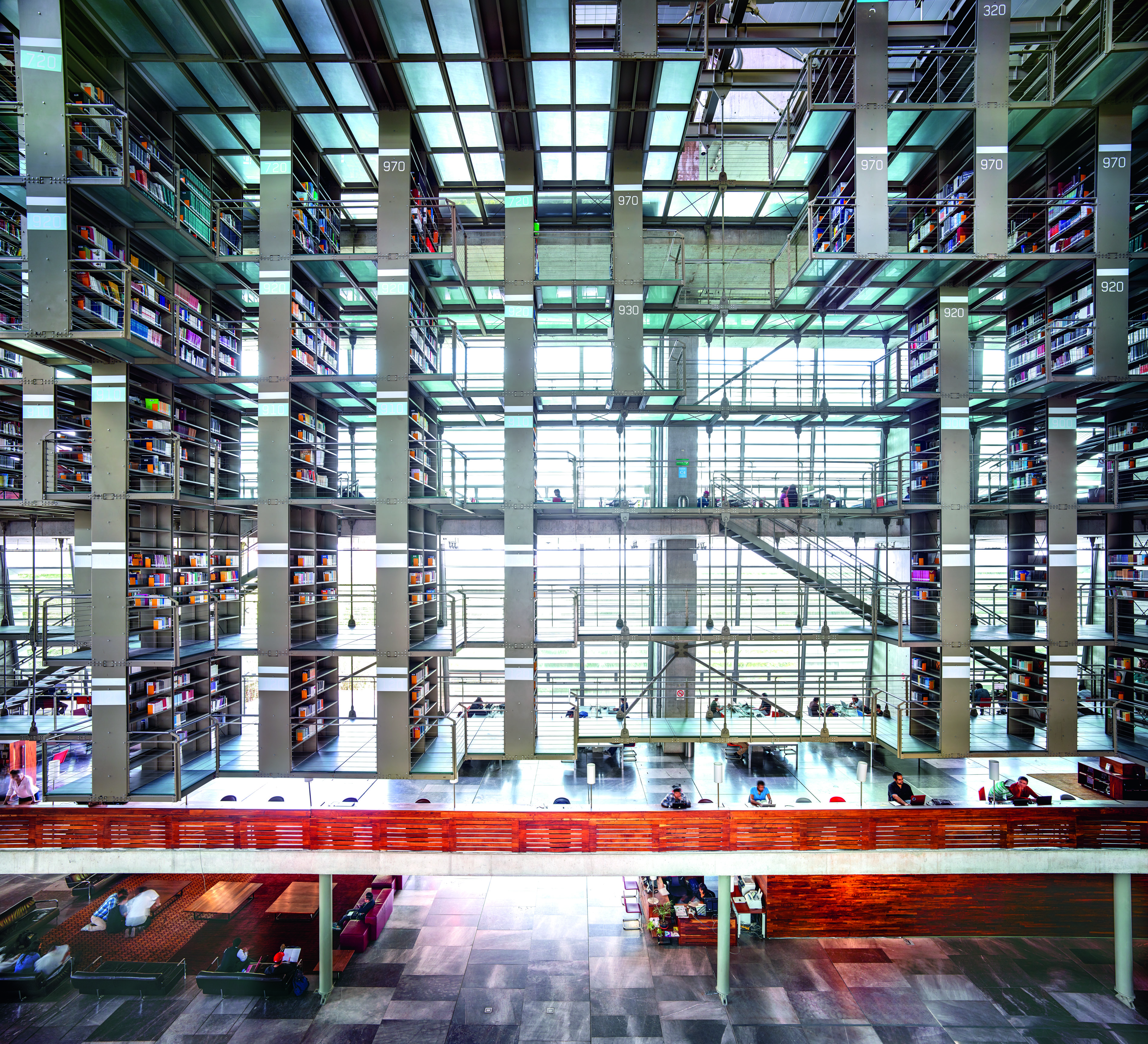 <em>Biblioteca Vasconcelos</em>, 2015 ” width=”3795″ height=”3452″><figcaption><em>Biblioteca Vasconcelos</em>, 2015 </figcaption></figure></p></p><p>Whether or not you hew toward the religious, even the most atheistic leaning-person has to revel in the awe-striking Modernist cathedral that is Mexico City’s Vasconcelos Library, where architect Alberto Kalach casts a spell with a luminous glass facade cutting crisp, Tron-like halos around a maze of metal stacks which appear to hover inside his extraterrestrial concrete vessel. The same might be said of the experience of craning one’s neck to consume Jacobo Gálvez and Gerardo Suárez’s vault fresco—depicting a scene from the fourth canto of Dante Aligheri’s “Divine Comedy”—as it floats above the gilded columns and crimson walls of Guadalajara’s neoclassical icon Teatro Degollado. Now imagine you’re the only person inside one of these hallowed halls—a private audience for an all-encompassing architectural rapture where every light, color, and shape is articulated and attenuated for eye-popping, surround sound immersion—and you begin to understand the aim of the latest project from Cologne-based photographer Candida Höfer.</p><p>“When I visit cities I really like to walk around and look in buildings. I like buildings. I have respect for buildings,” says Höfer over an al fresco breakfast on the cafe terrace of Mexico City’s Museo Tamayo, where the artist participated in a morning panel on the heels of the Gallery Weekend opening for her most recent solo show, “In Mexiko,” at the new brutalist space of Galería OMR. After nearly a decade of entreaties to come shoot their homeland gallery founder Patricia Ortiz Monasterio and Jaime Riestra finally got word three years ago from Höfer, whom they began showing in 2005, that she would be ready to do a three-week shoot of sites around the country in October 2015.</p><p>The Tamayo panel and exhibition—a precursor to a current museum survey open through July at Mexico City’s Antiguo Colegio de San Ildefonso that will later travel to Monterrey’s Centro de las Artes, Puebla’s Museo Amparo and the North Carolina Museum of Art—were the result of that 2015 during which the septuagenarian artist captured 15 operatic locations (theaters, churches, monasteries, and libraries) across eight cities (from Jalisco to Guanajuato) the same wide-format style that has turned her steroidal optics into market and museum sensations the world over.</p><p>“We made a first selection of 150 buildings that we thought would be interesting for her and from that list she chose maybe 35 and then we had to shorten the list to the times she had available. We could not go to the north of the country and then all the way to Yucatán and then to Jalisco and then Veracruz,” explains Monasterio, who produced the seven-hour shoot alongside Riestra, arranging everything from meals to lighting to housecleaning. “In Mexico, especially in churches, people are very religious and they just fill the spaces with crosses and flowers, a little bit of this and that, so we would have to clean the space and hide cables and remove flowers and tacky things.”</p><figure class=