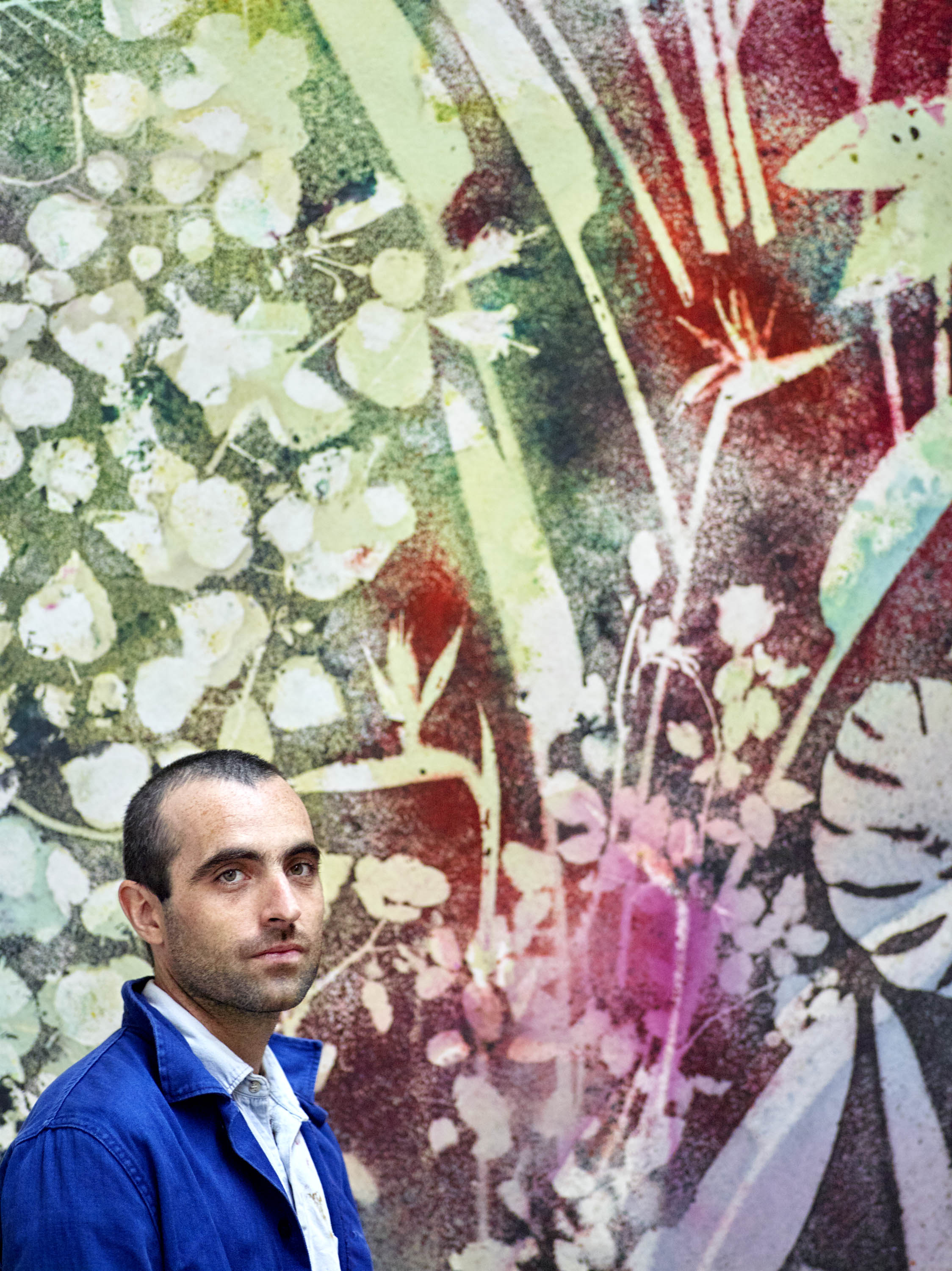 Sam Falls photographed in Los Angeles in front of his photogram, 2018.