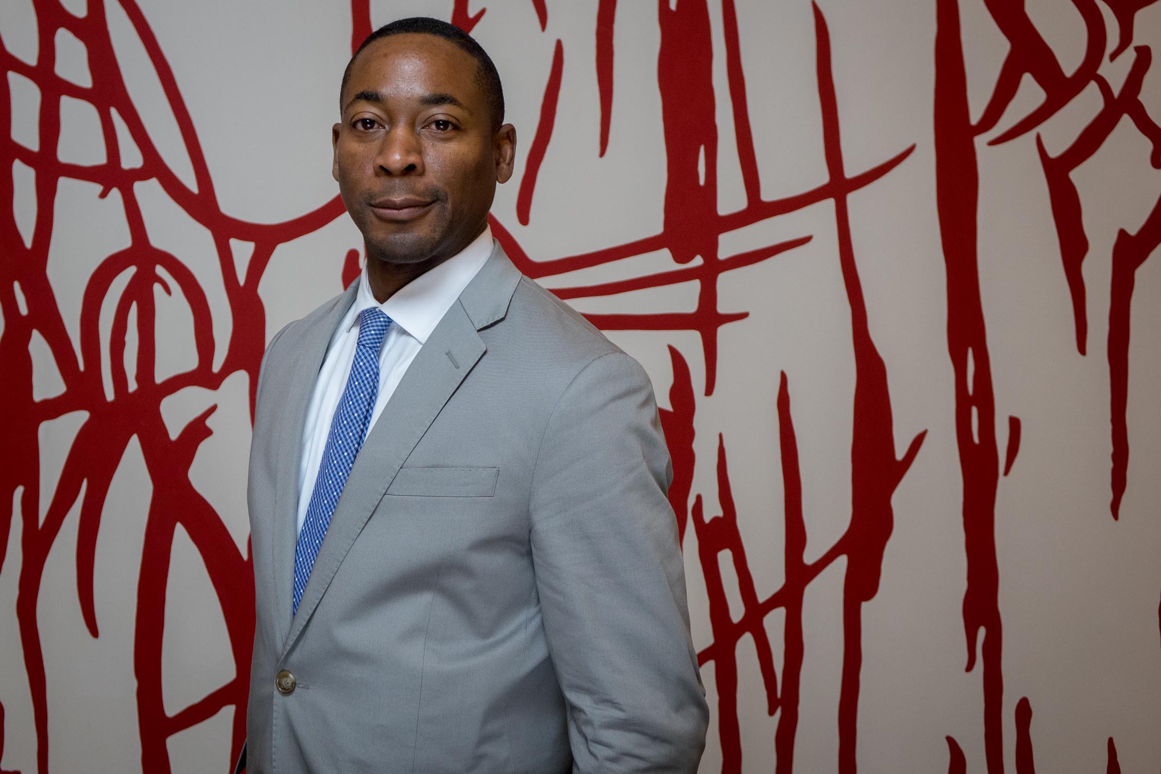 Franklin Sirmans with Arturo Herrera's When Alone Again III (2001). Photo by Angel Valentin, courtesy of Pérez Art Museum Miami.