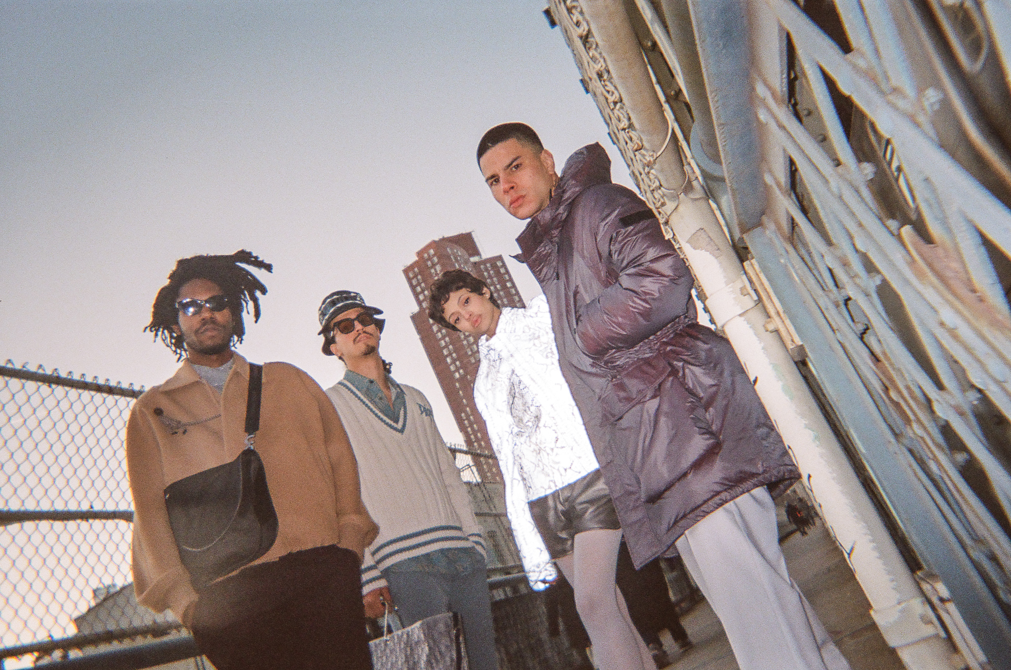   From left: Austin Williamson, Isaiah Barr, Eloisa Santos and Shawn Powers on the Manhattan Bridge. Styled by Sebastian Jean. Stylist Assistant: Share Koech. Hair: Illeisha Lussiano. All fashion by Dior.  Produced by Isabel Flower. 