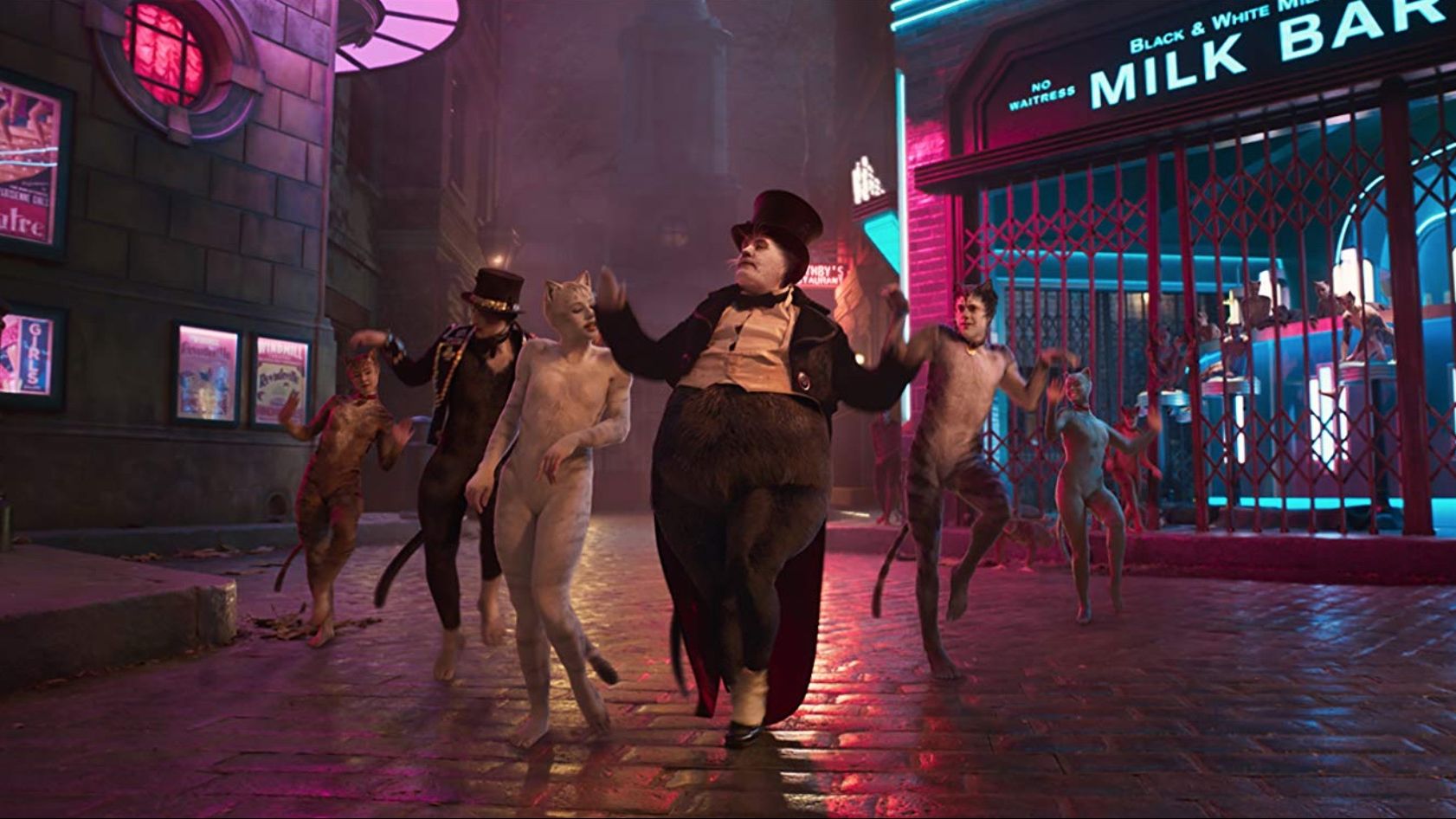 James Corden, Laurie Davidson, and Francesca Hayward star in Tom Hooper's Cats (2019). Courtesy of Universal Pictures.