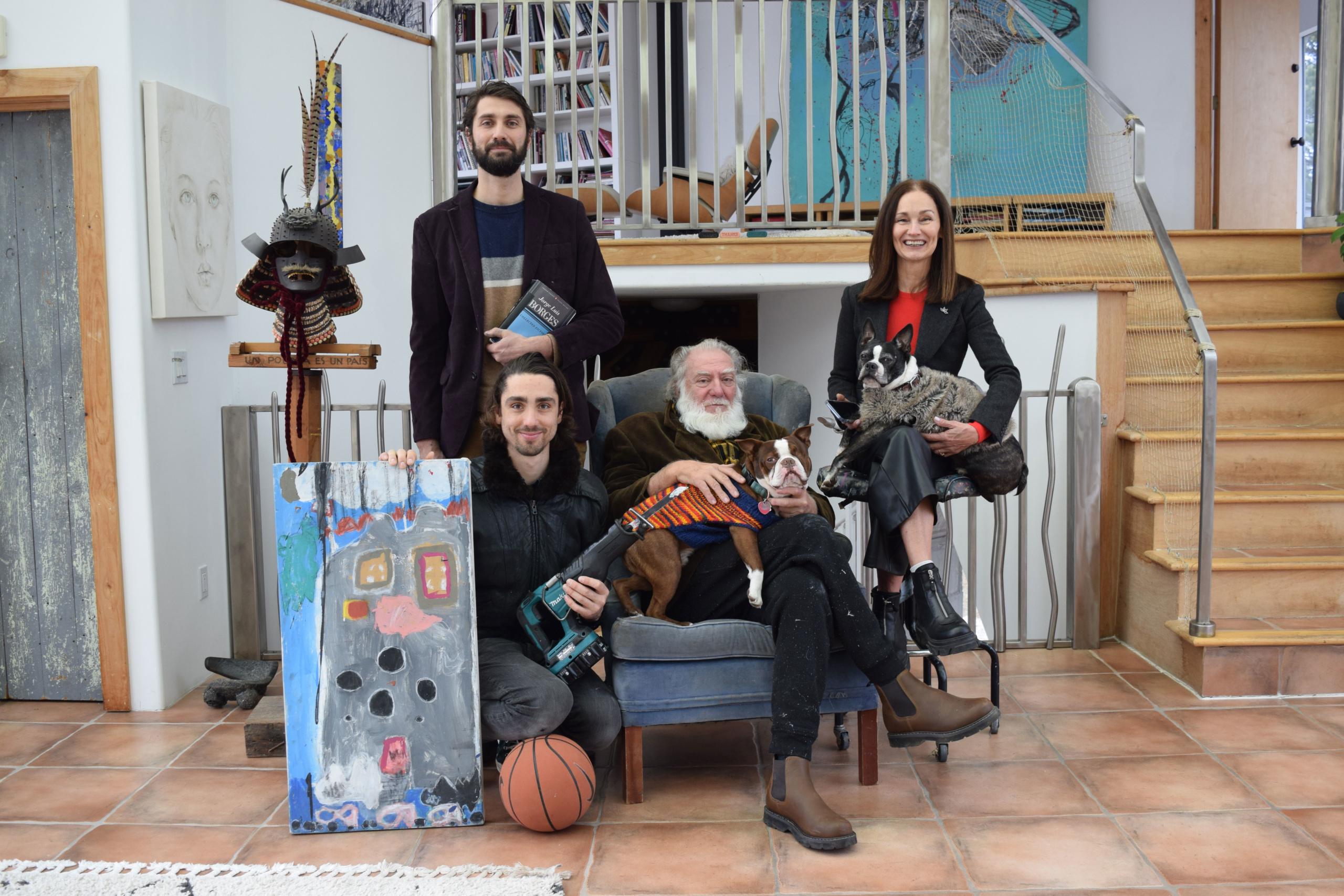 Lautaro, with book, and, from left, Franco, Eugenio and Ruth Cuttica recreate their first family photo taken when they immigrated to the United States.
