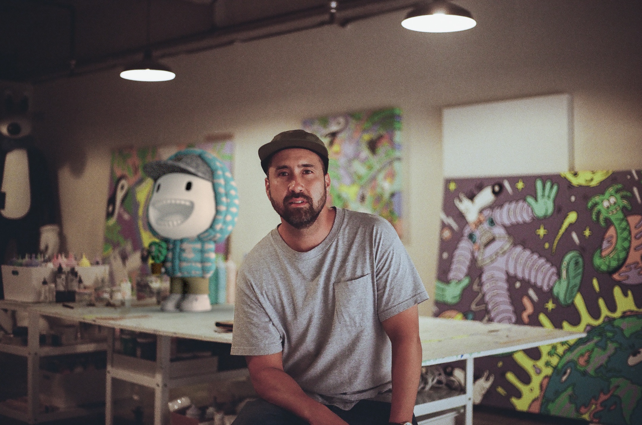 Artist Steven Harrington in the studio with his design for Moncler's Pupazzo art toy.