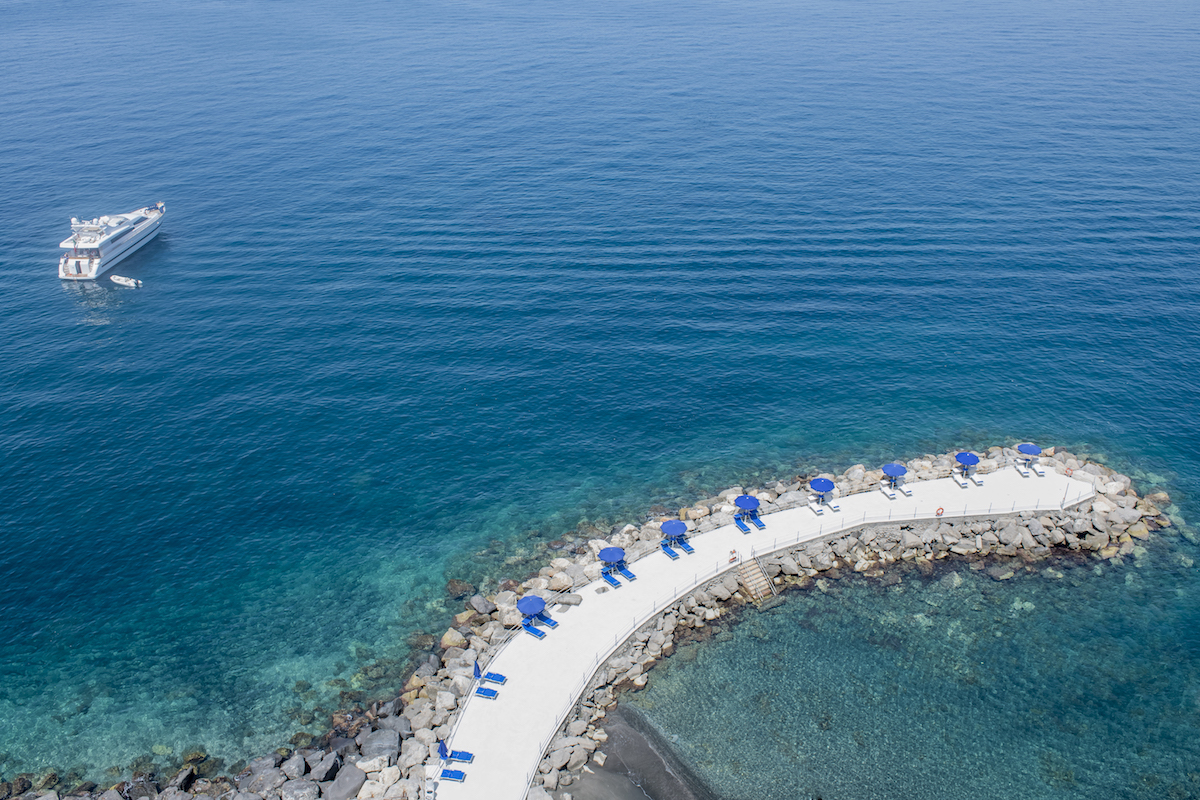 breakwater dock in bright blue waters off sorrento from hotel parco dei principi