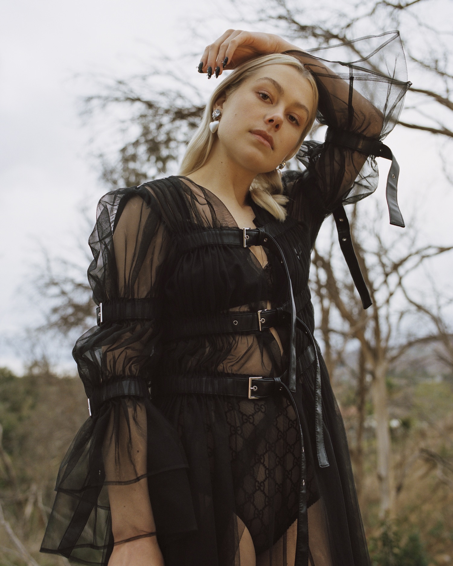 Phoebe Bridgers. Photography by Daria Kobayashi Ritch. Styling by Tess Herbert. Makeup by Sandy Ganzer. Hair by Nikki Providence. Bridgers wears a vintage Noir Kei Ninomiya dress from Replika Vintage, Gucci underwear and the stylist's own earring.