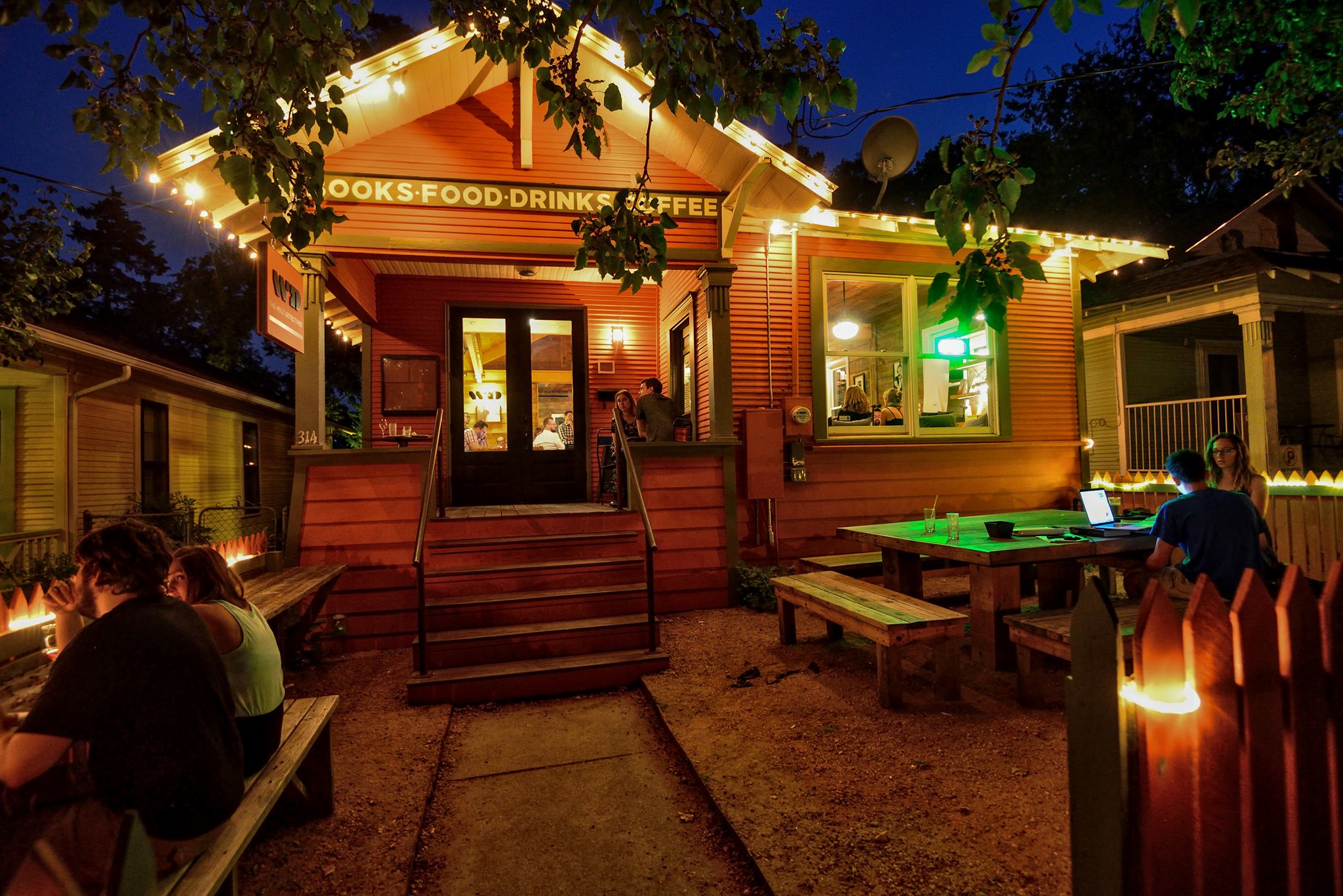 outside of the wild detectives a dallas bookstore with community event space and picnic tables out front